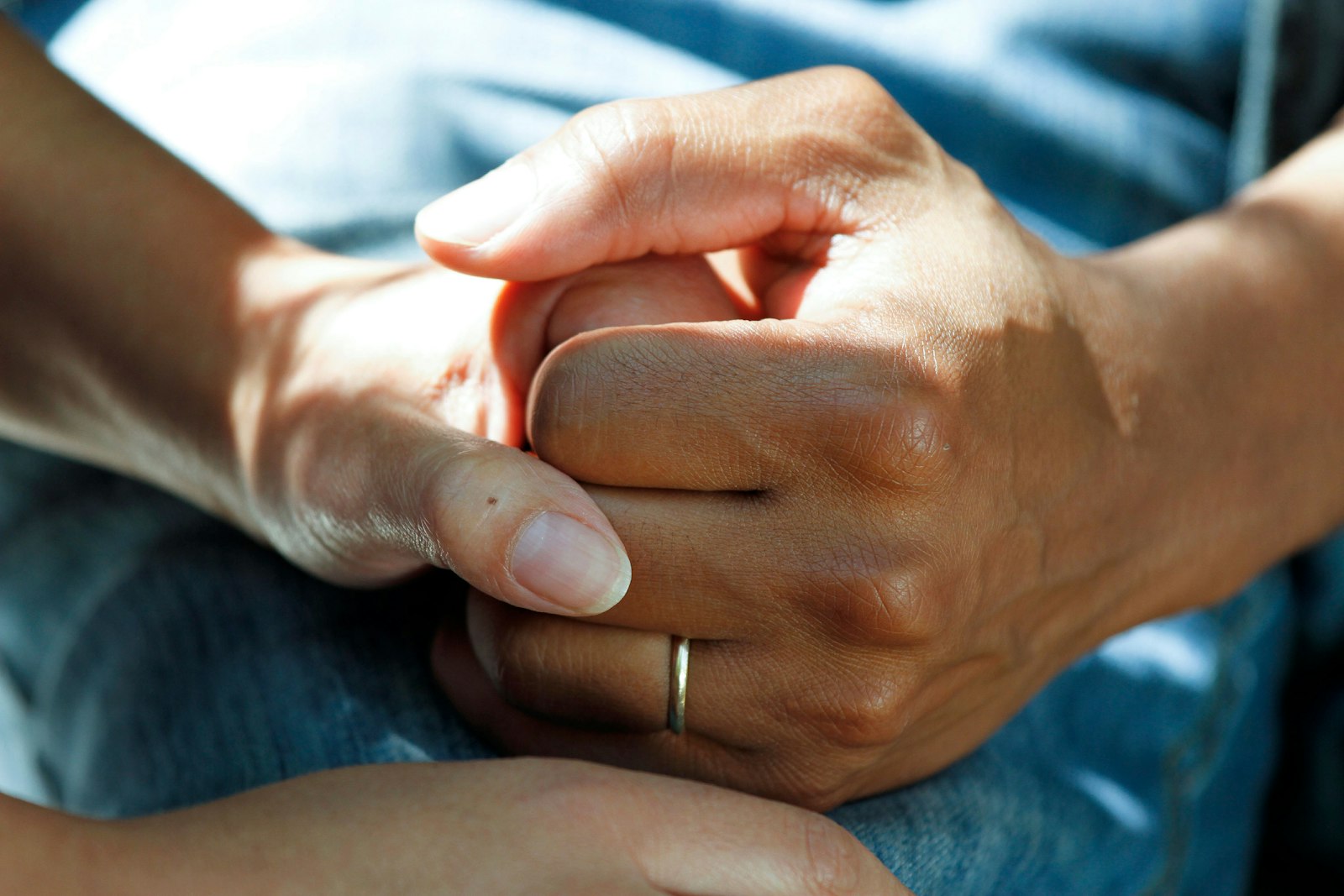 A therapist holding a patient's hand